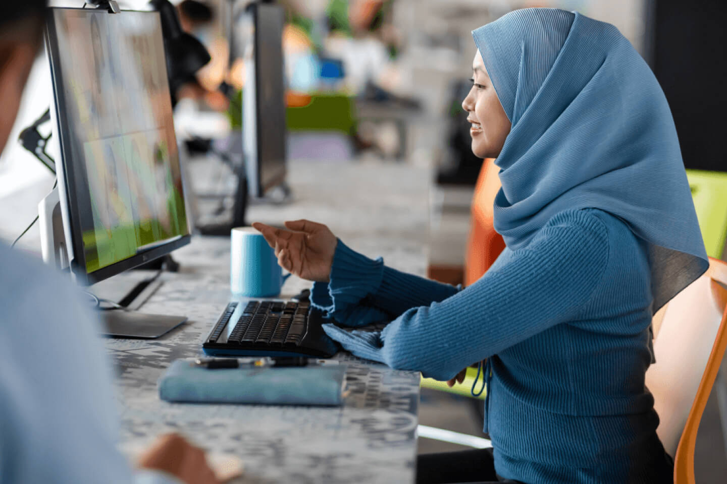 Office worker on video call with colleagues