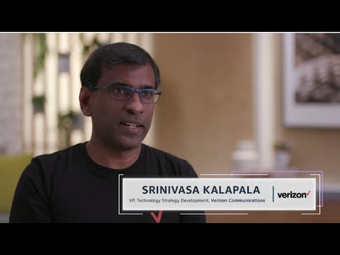 Srinivasa Kalapala, VP of Technology Strategy Development at Verizon Communications, is interviewed in a professional setting, with a Verizon logo displayed on the screen.