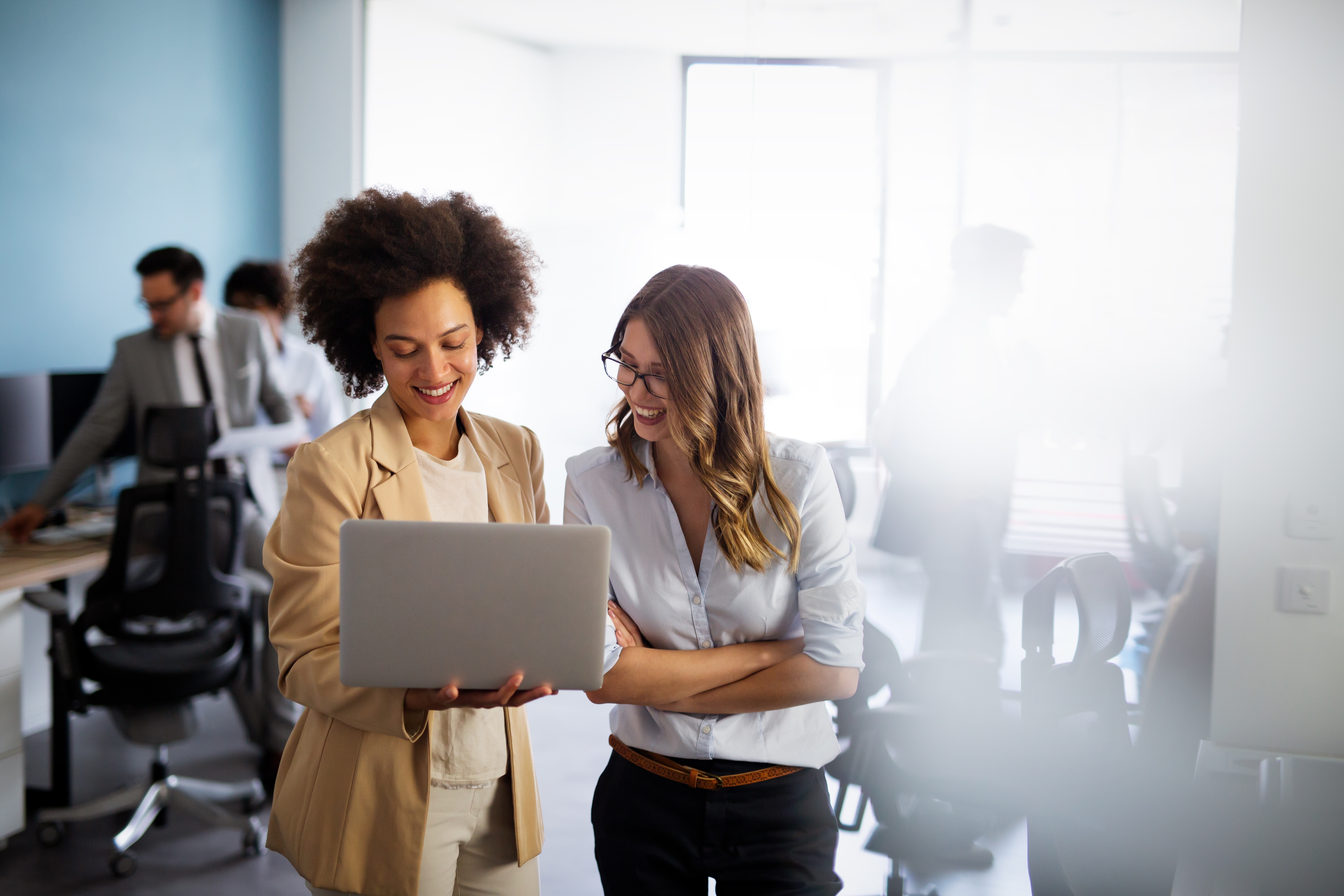 Happy multiethnic smiling business women working together in office; Shutterstock ID 2232485903; purchase_order: miro case study; job: AWS; client: case study; other: EMEA