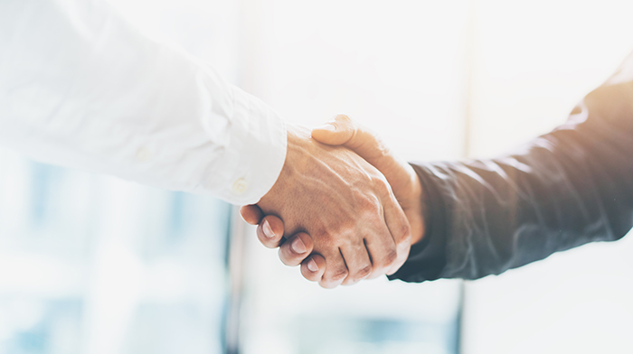 Business partnership meeting. Picture businessmans handshake. Successful businessmen handshaking after good deal. Horizontal, blurred background; Shutterstock ID 414162808; purchase_order: PDP pages; job: Wickr; Use Case: (internal materials or creative mockup): Webpage - PDPs for Wickr