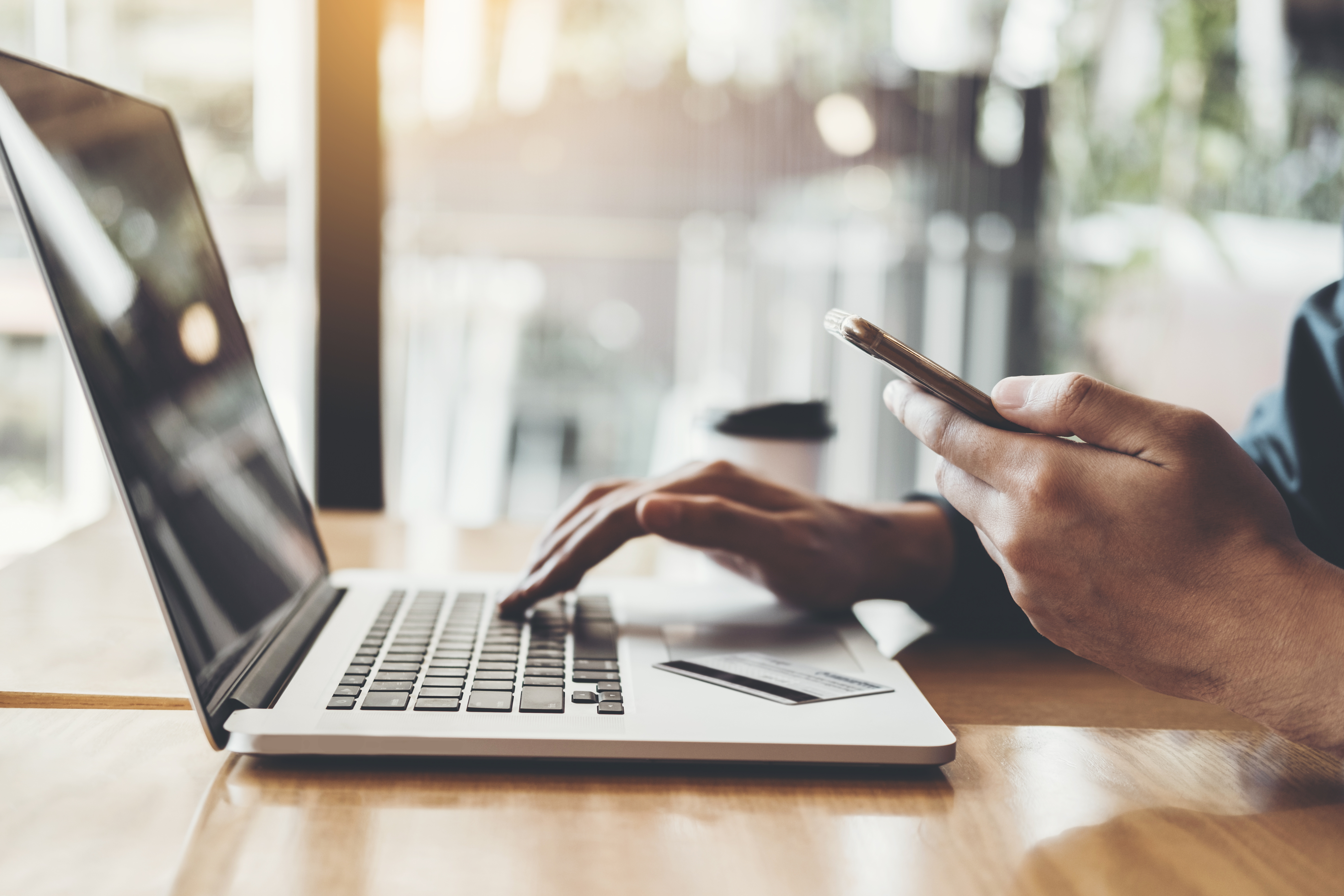 Online banking businessman using Laptop with credit card Shopping online Fintech and Blockchain concept
