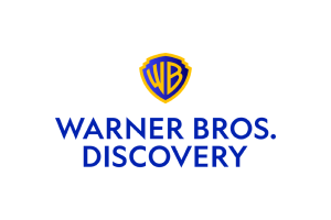 The Warner Bros. Discovery logo featuring a blue and yellow shield above the company name in blue text.
