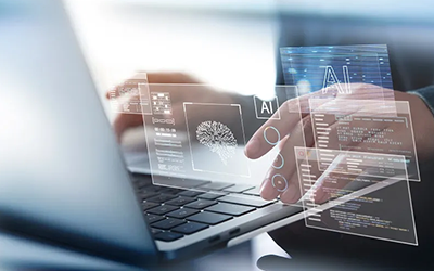 Hands typing on a laptop keyboard with virtual interface overlays displaying AI, code, and a digital brain, representing artificial intelligence and machine learning development.