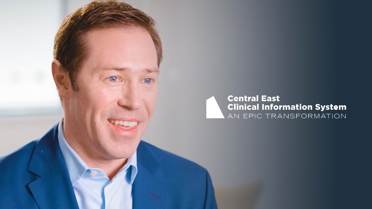 A man in a blue suit smiling, with the text 'Central East Clinical Information System: An Epic Transformation' on the image, representing a case study in healthcare information systems.