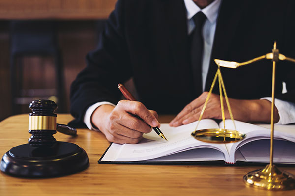 Judge gavel with Justice lawyers, Businessman in suit or lawyer working on a documents. Legal law, advice and justice concept.