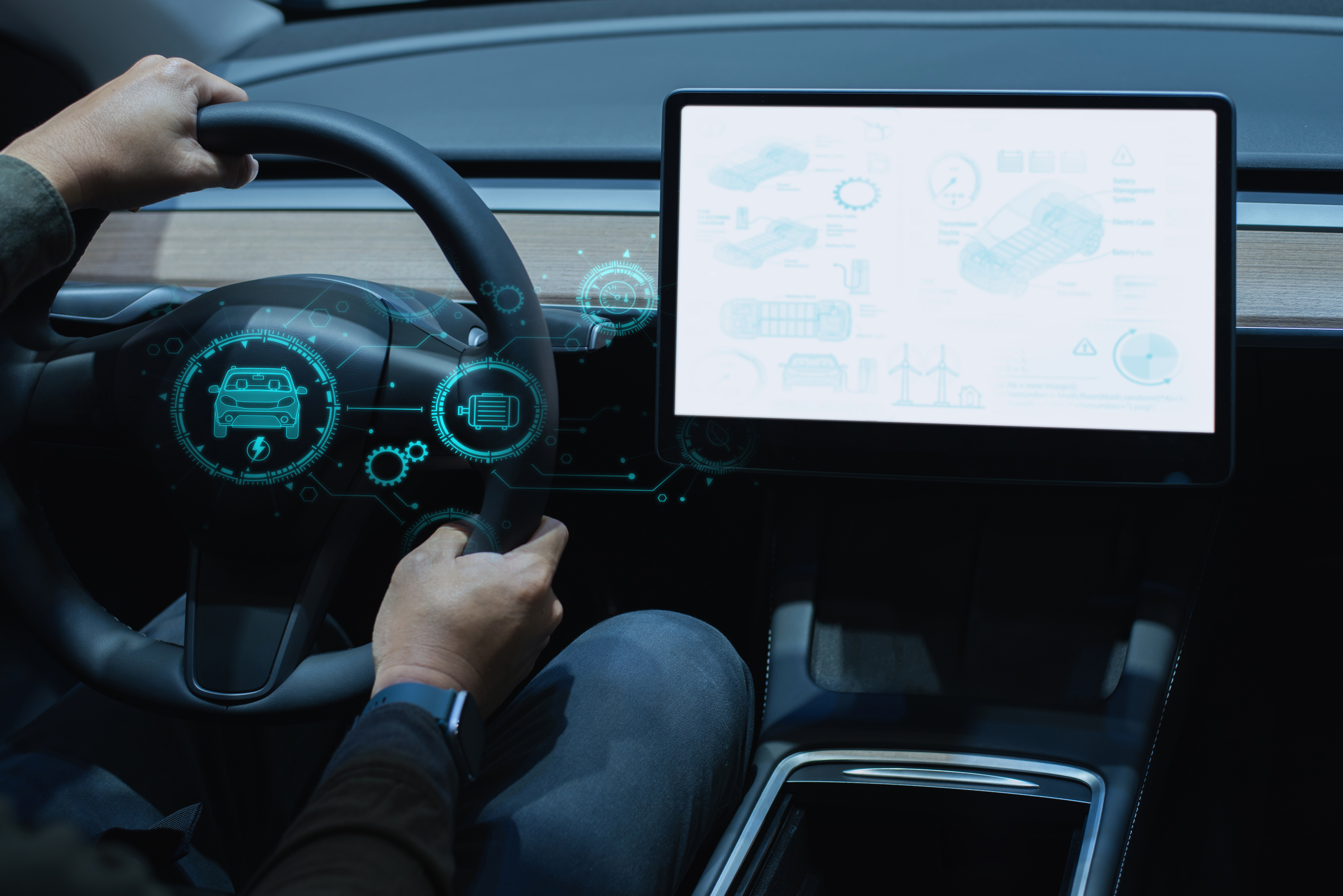 Person driving a modern electric car with a digital touchscreen dashboard and virtual interface displaying vehicle and battery system data.