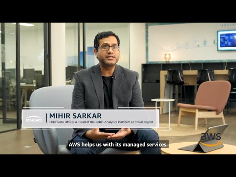 Mihir Sarkar, Chief Data Officer & Head of the Robin Analytics Platform at ENGIE Digital, is interviewed in an office setting. The caption reads, 'AWS helps us with its managed services.'