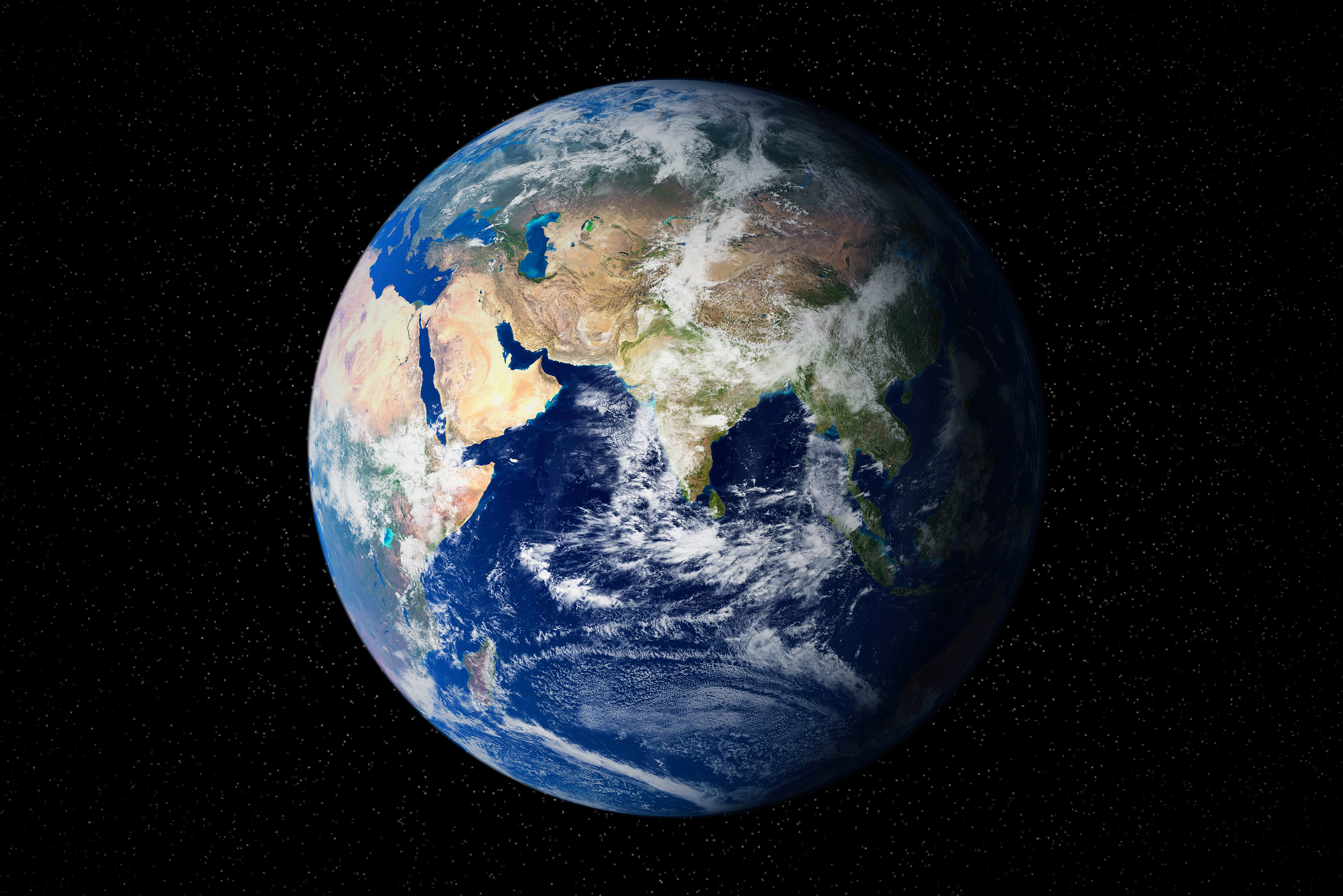A high-resolution image of planet Earth as seen from outer space, featuring visible continents, oceans, and cloud formations, set against the backdrop of the blackness of space. NASA/JPL image.