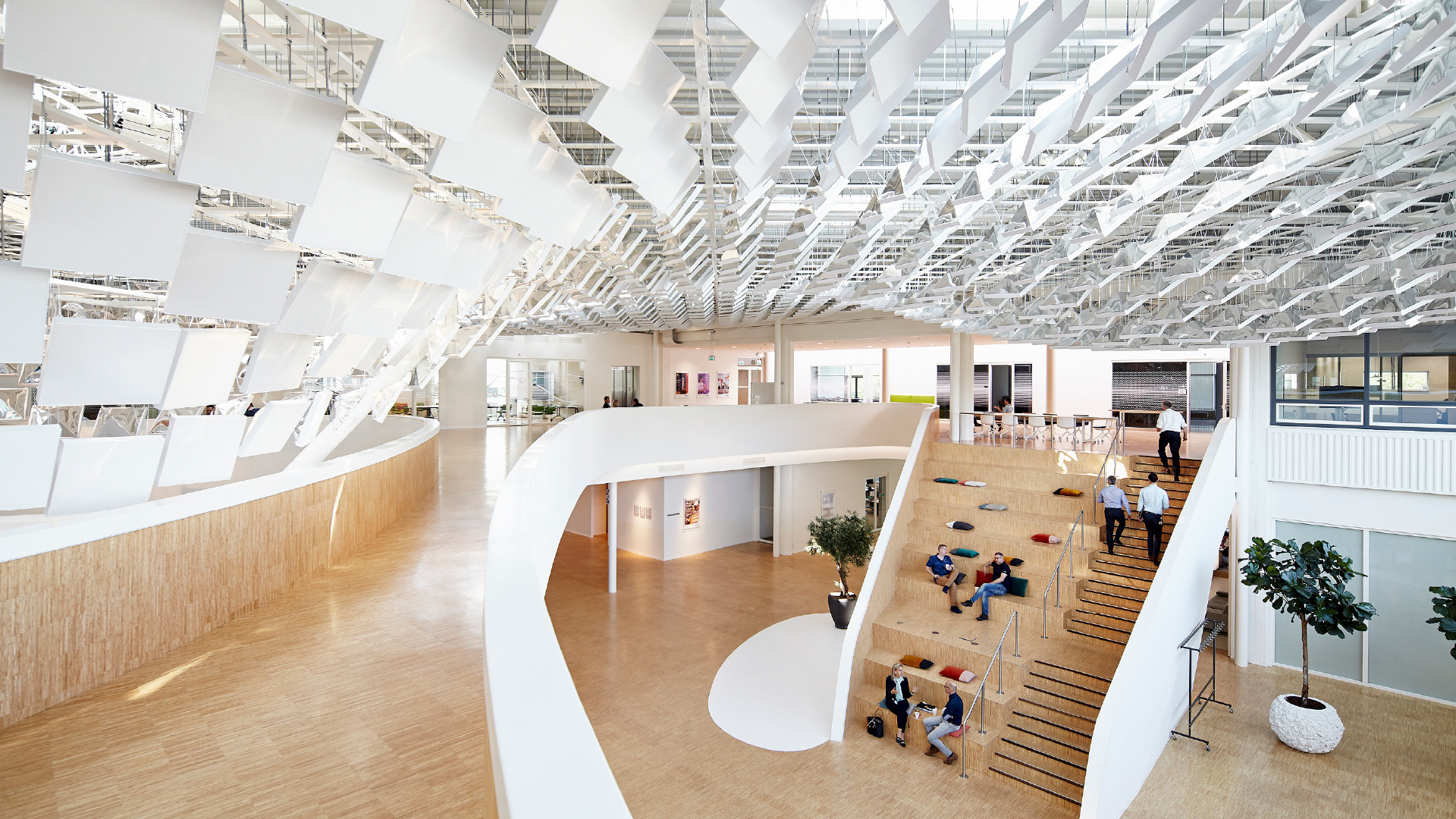 People moving through a spacious, modern building