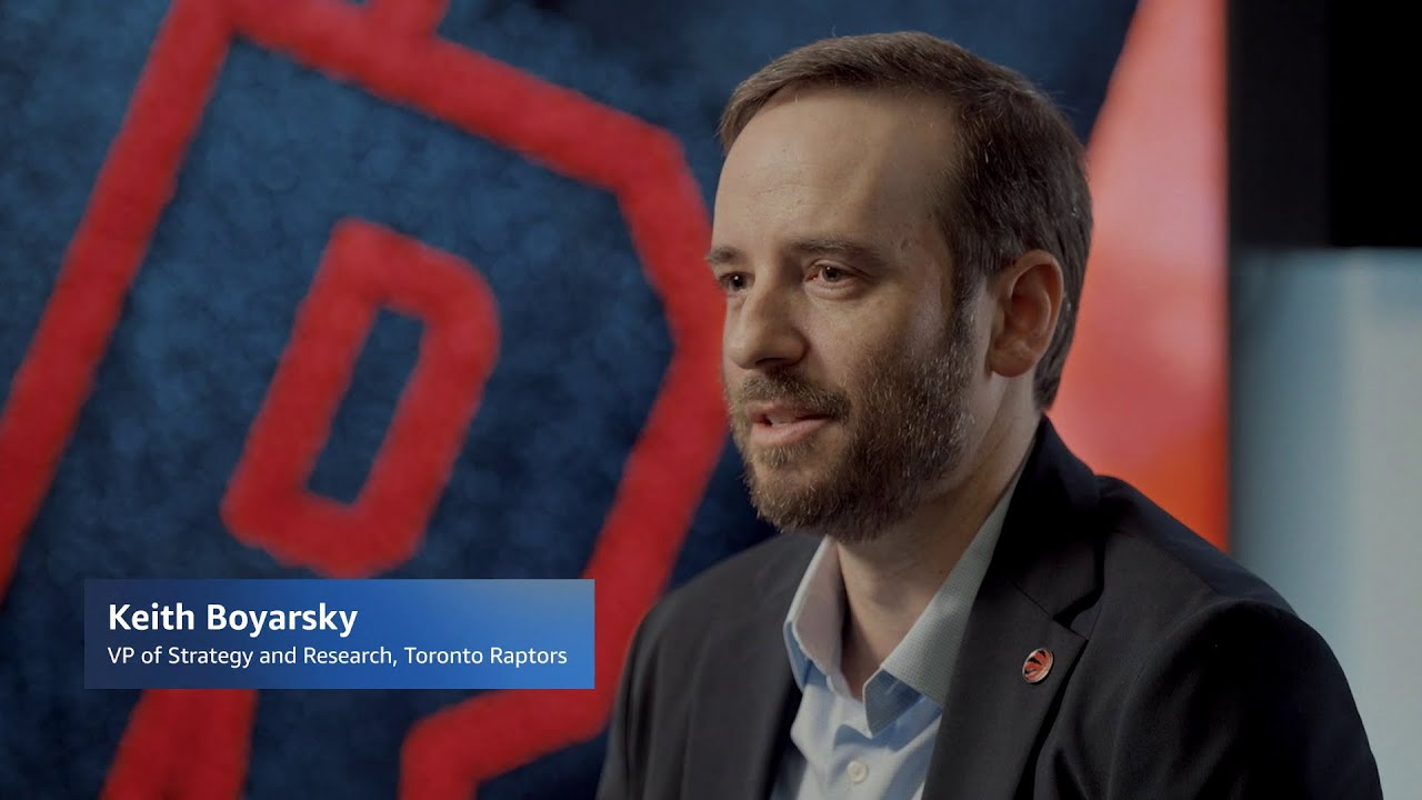 YouTube thumbnail image featuring Keith Boyarsky, VP of Strategy and Research for the Toronto Raptors, in an interview setting with a blurred Toronto Raptors logo in the background.