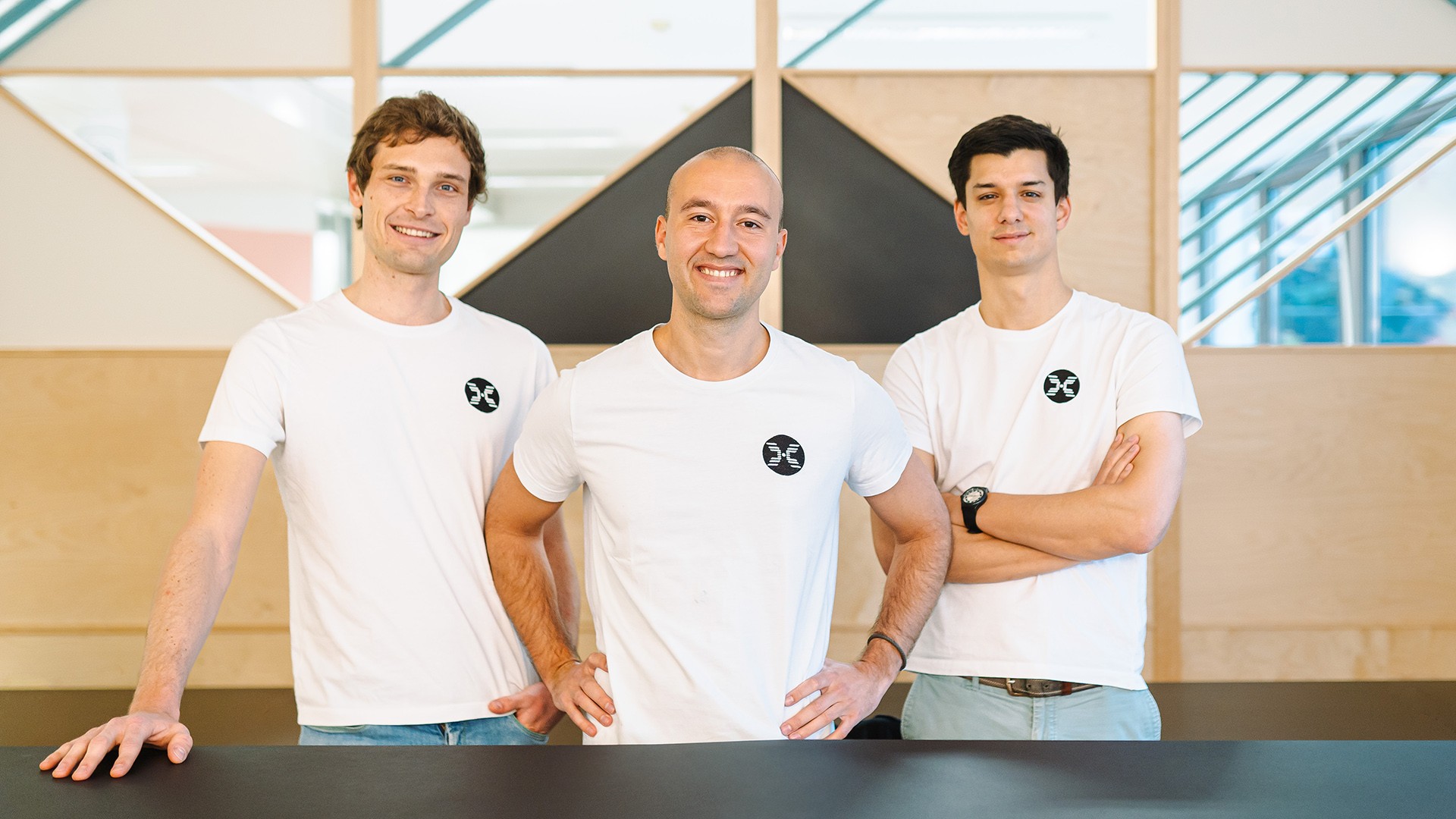 Helical co-founders and leadership team standing together in an office