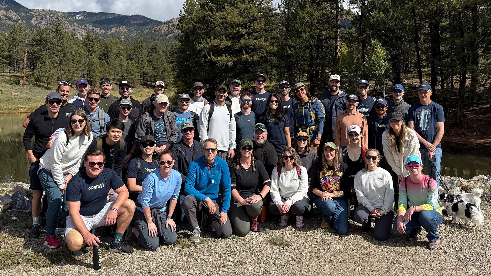 Parsyl team group photo on a hiking retreat beside a mountain lake