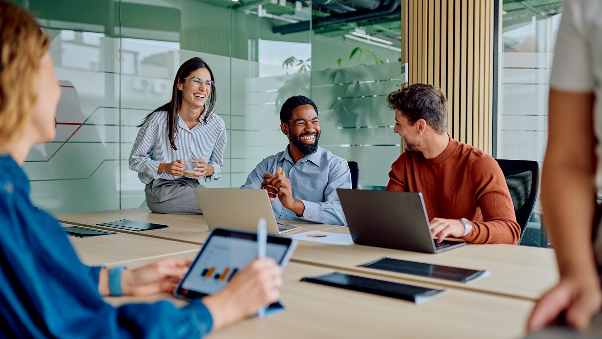 Diverse team collaborating in a modern office during an AI project discussion