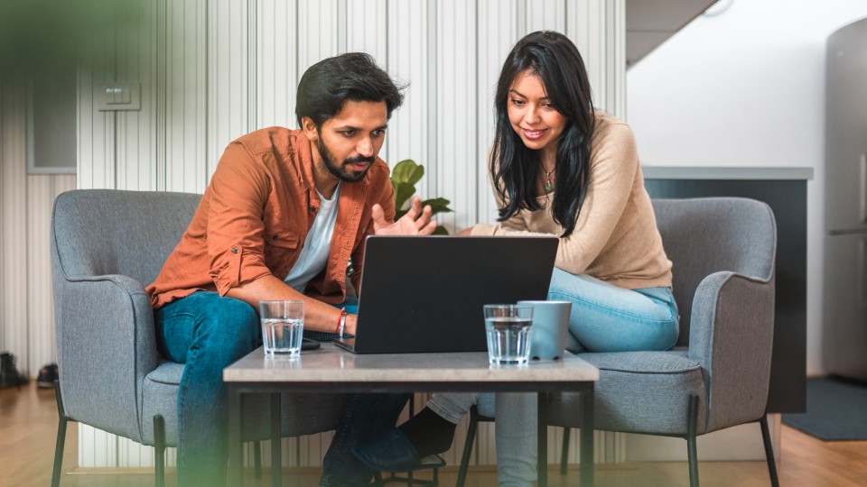 Colleagues looking at screen together