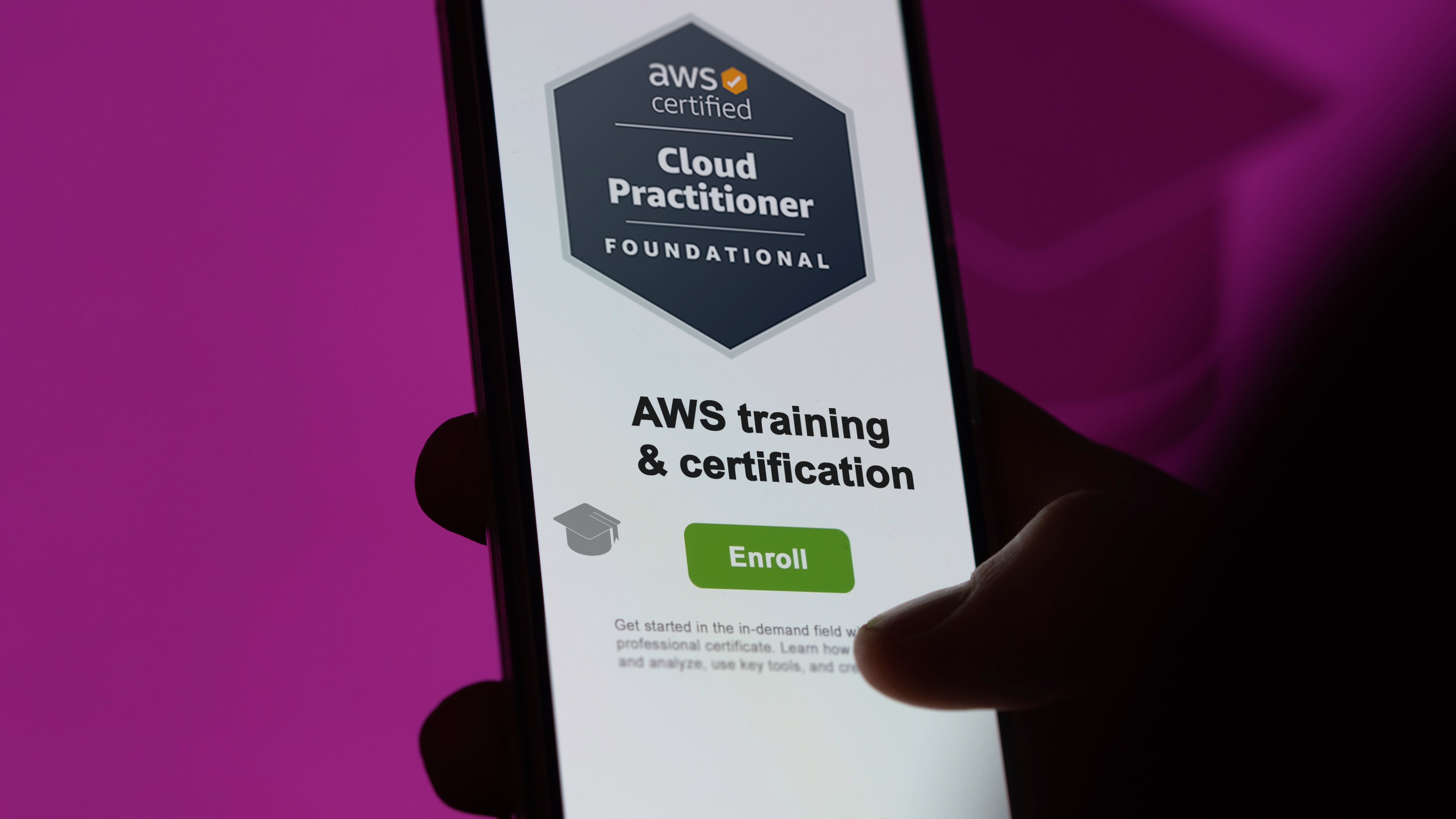 A mobile device screen displays the AWS Certified Cloud Practitioner foundational badge and an AWS training & certification enroll button with a magenta background.