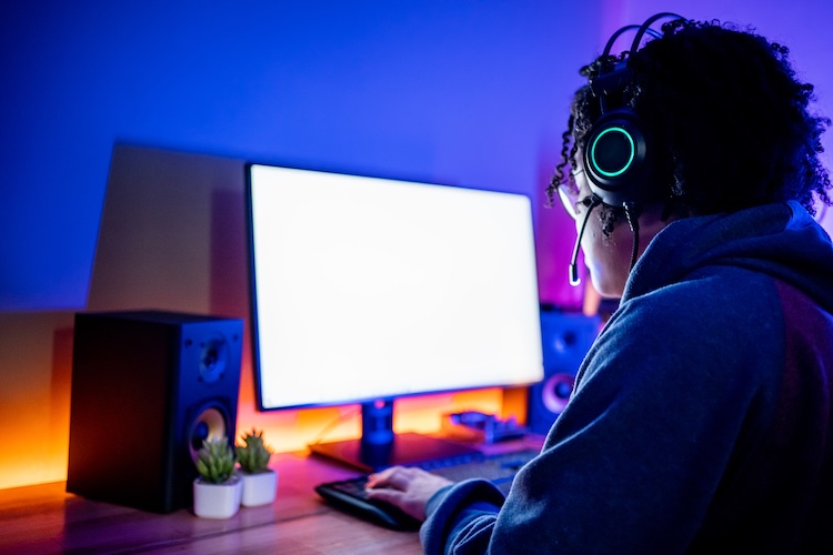 Professional gamer woman playing online with friends