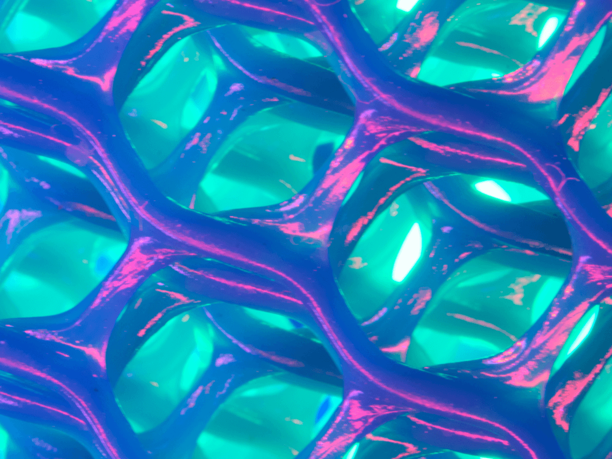 Abstract close-up image of a blue and purple 3D mesh texture with glowing turquoise lighting.