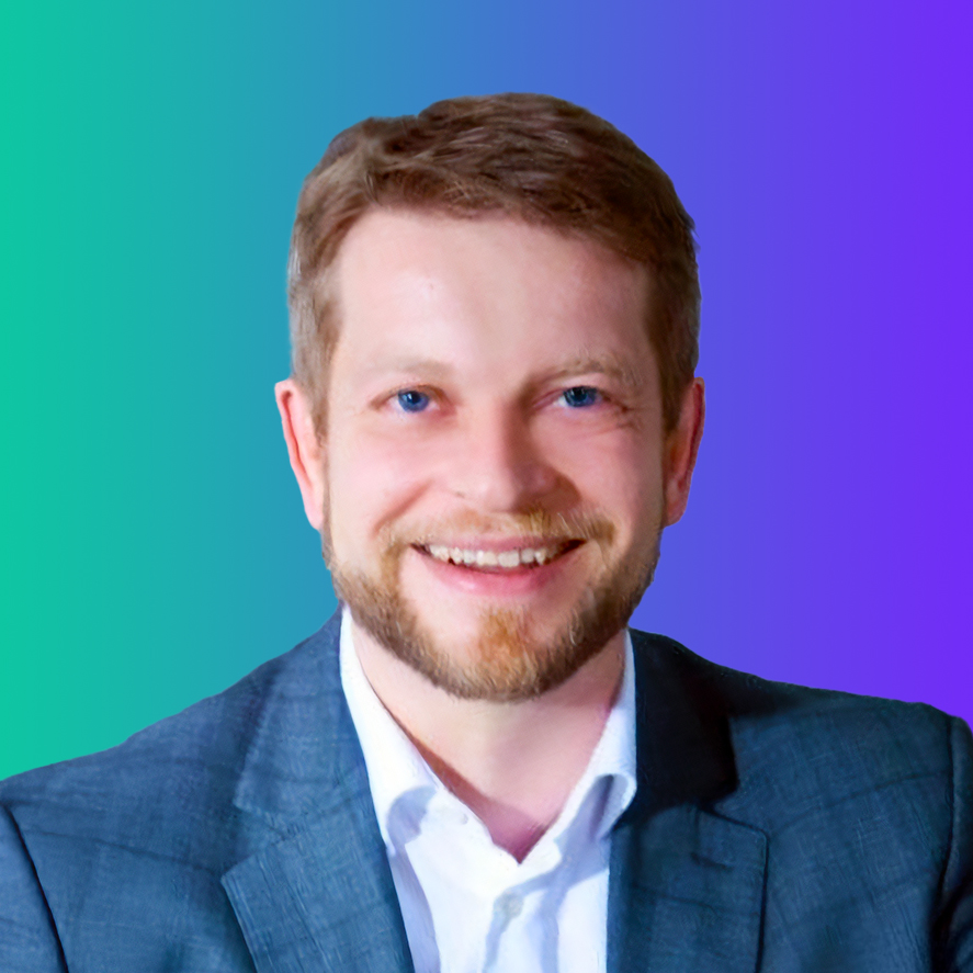 Portrait of a smiling man in a suit with a blue, teal, and purple gradient background