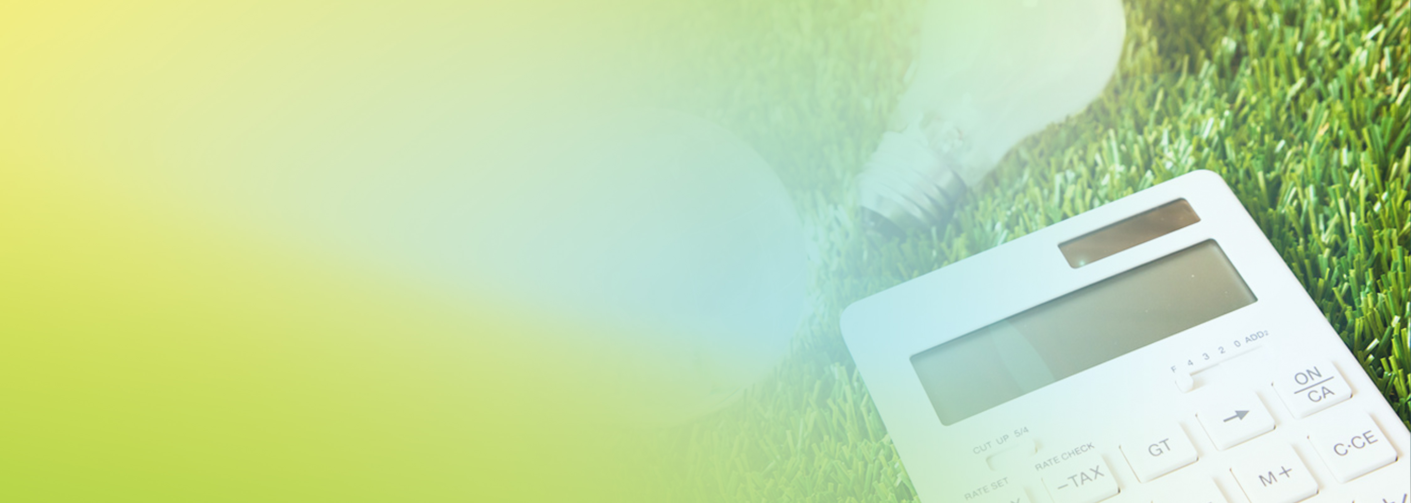 A calculator and a light bulb placed on green grass, representing AWS cost optimization solutions. The image suggests calculating savings and efficient use of resources.
