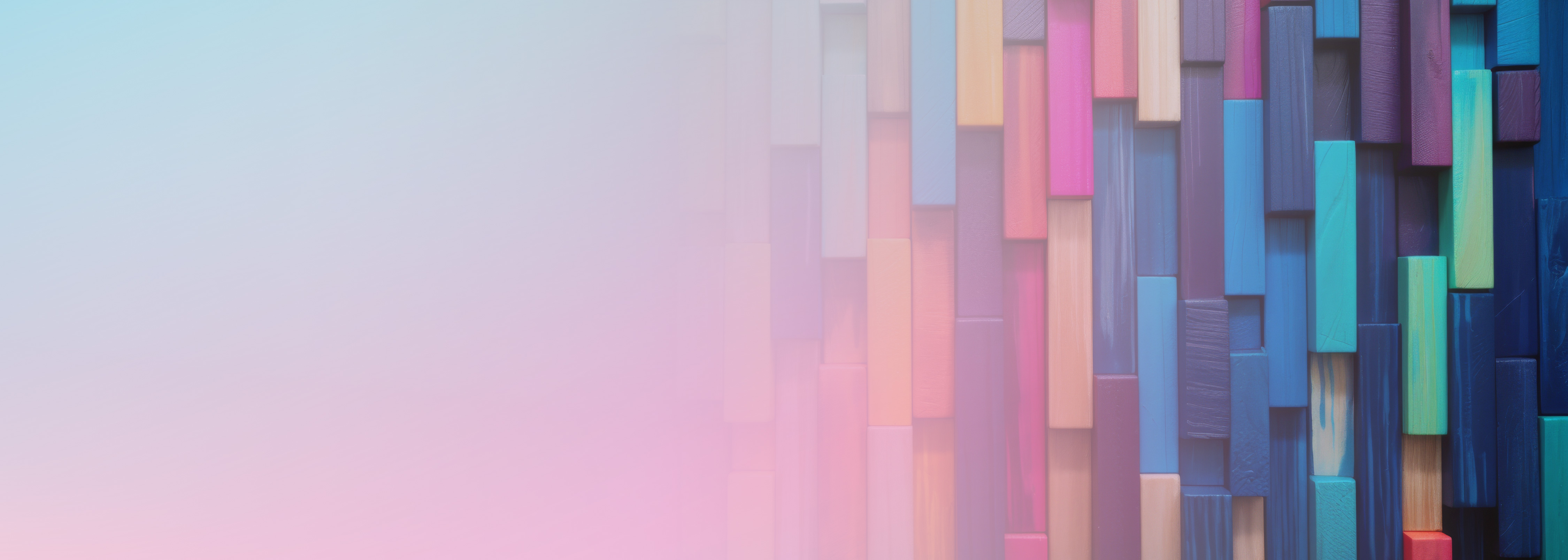 Abstract background image featuring a pattern of colorful rectangular blocks on the right side, with a gradient soft blue and pink area on the left, representing architecture and design concepts for web applications.