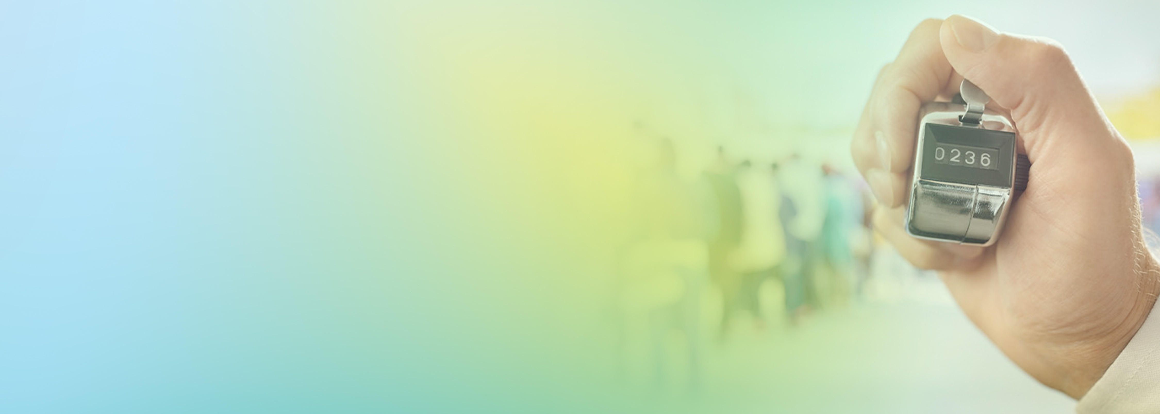 A hand holding a mechanical tally counter displaying the number 236, with a blurred background of people standing in a line, representing a real-time counting system.