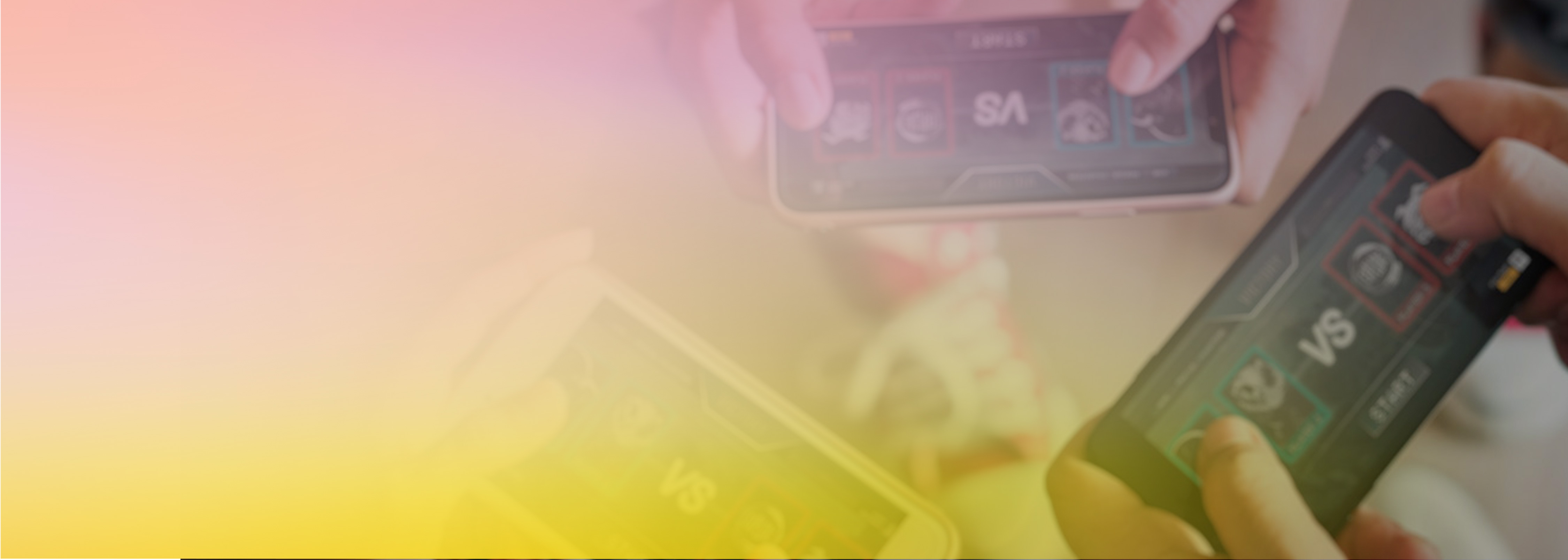 Hands holding mobile devices with a versus screen, representing the creation of a multi-player game.