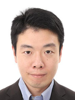 Professional headshot of an Asian male in a suit, front-facing, against a white background.