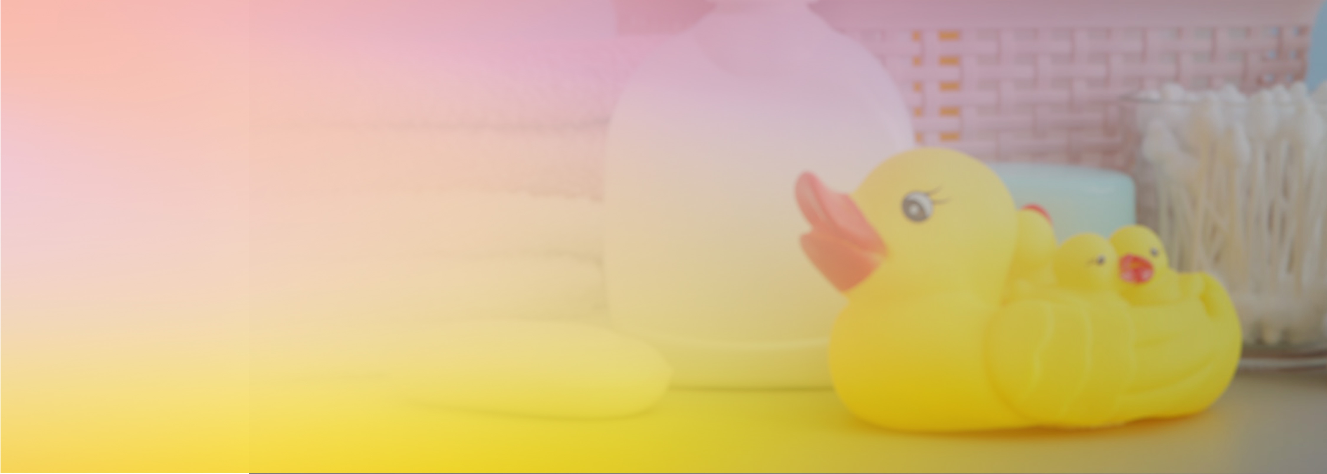 A soothing pastel image featuring towels, cotton swabs, a soap bar, and a set of yellow rubber ducks, evoking themes of childcare and bath time.