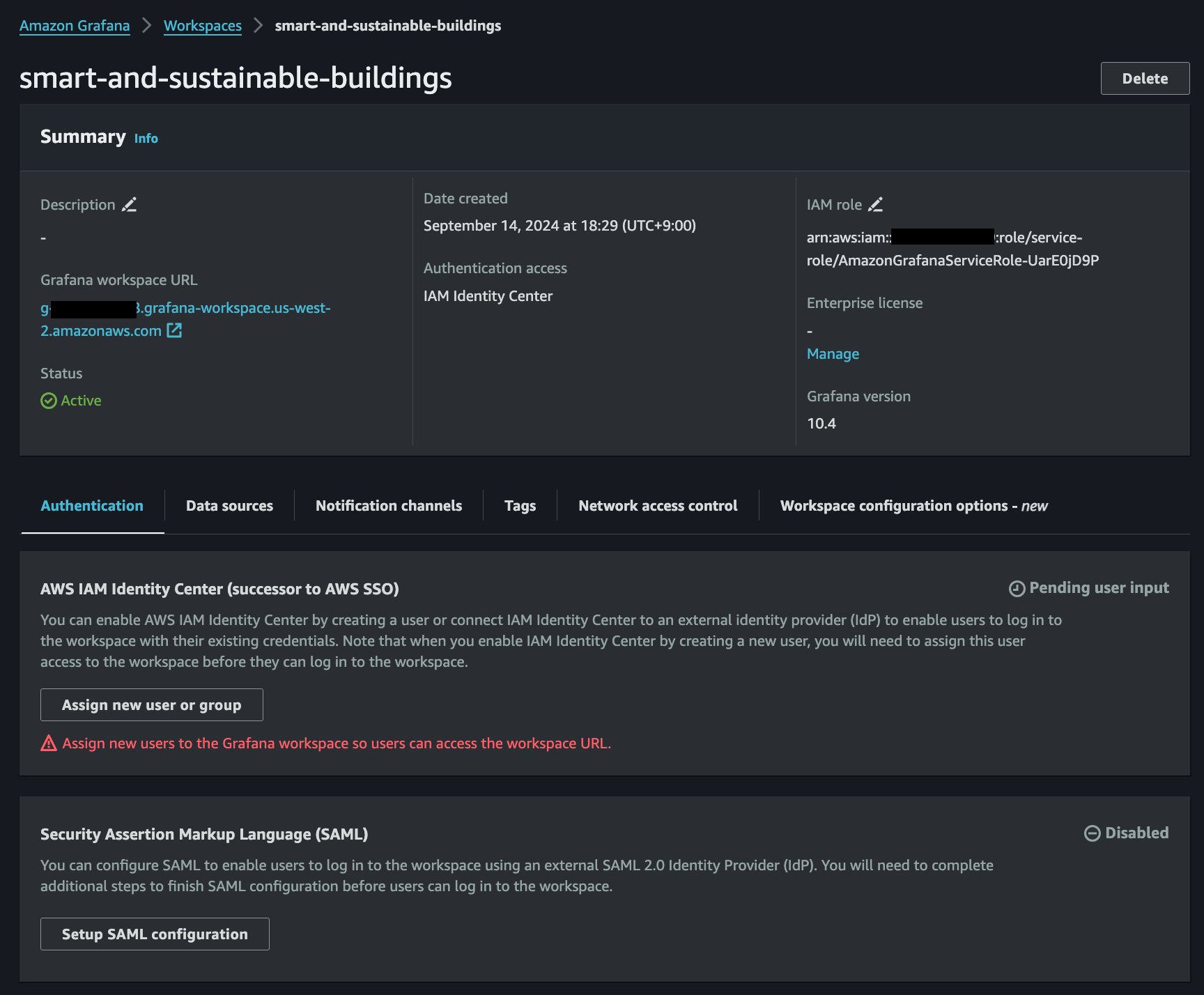 Screenshot of the Amazon Grafana workspace summary for 'smart-and-sustainable-buildings', showing configuration details such as workspace URL, IAM Identity Center authentication, status, IAM role, and options for SAML setup.