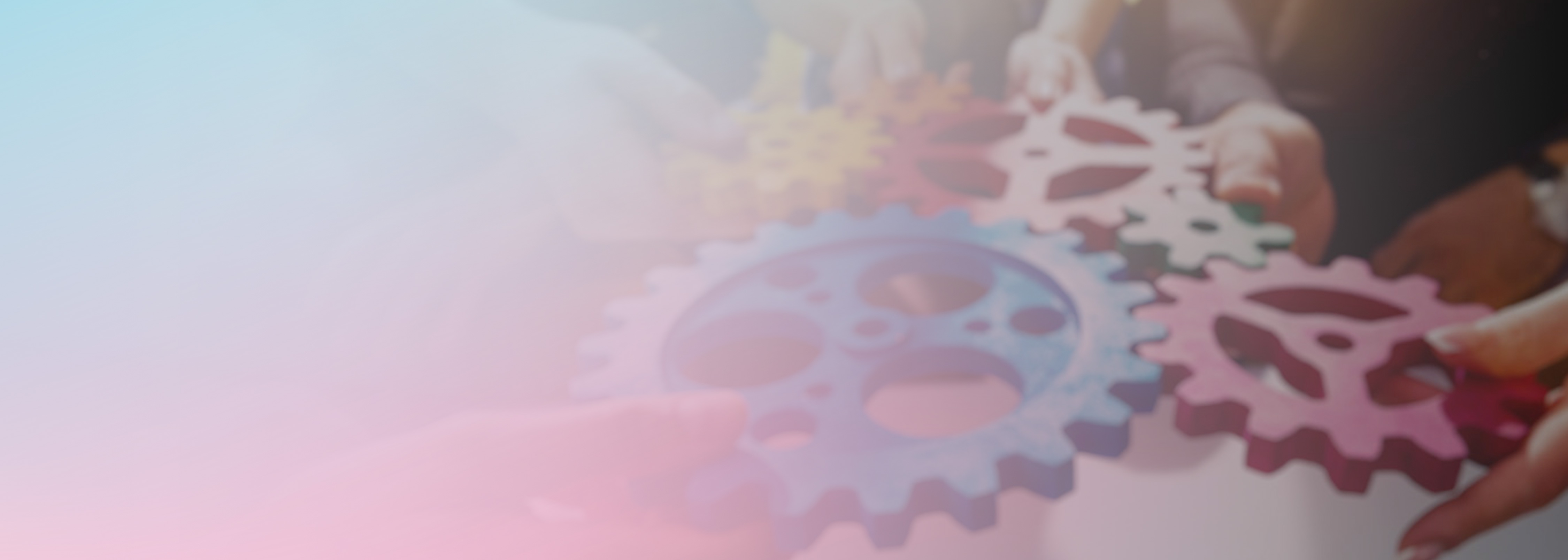 Several hands assemble colorful gear cogs together, representing teamwork, collaboration, and the process of making something work better, metaphorically illustrating tips to improve a demonstration or project.