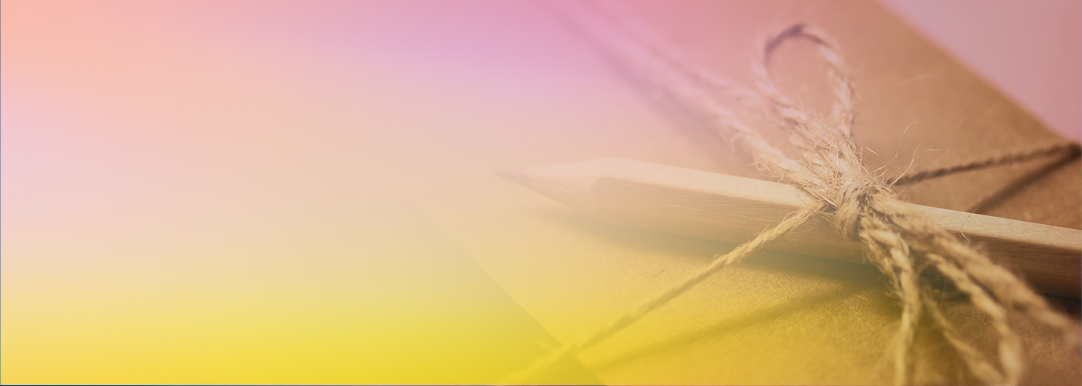 Image of a pencil and tied string on a brown envelope with a pastel gradient overlay, symbolizing asynchronous processing and queue concepts.