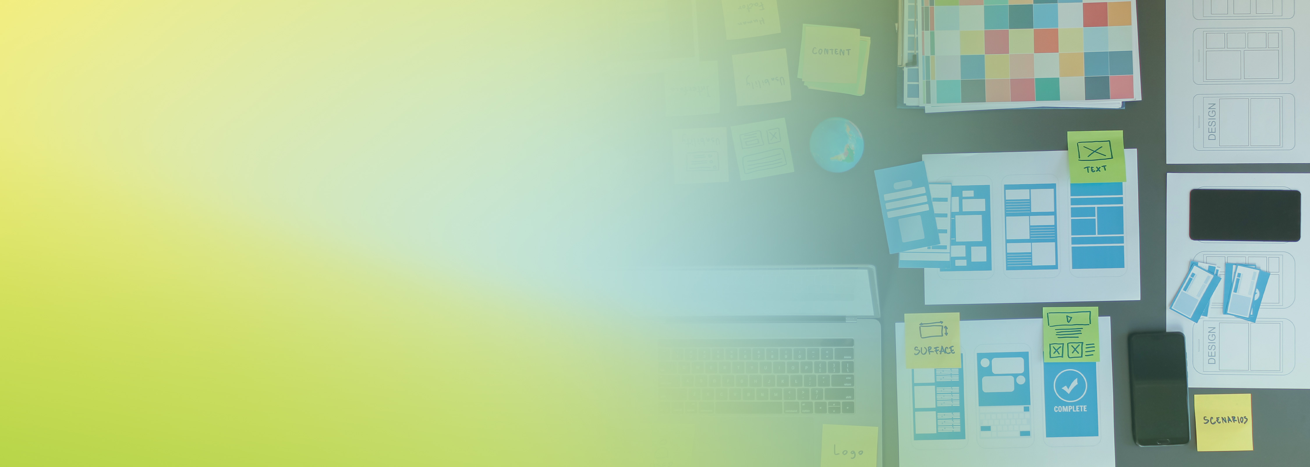 Top-down view of a workspace with prototyping materials, sketches, colorful sticky notes, and a laptop, illustrating distributed application testing and interface planning, with a faded yellow and green gradient overlay. Used to represent main distributed testing on AWS.