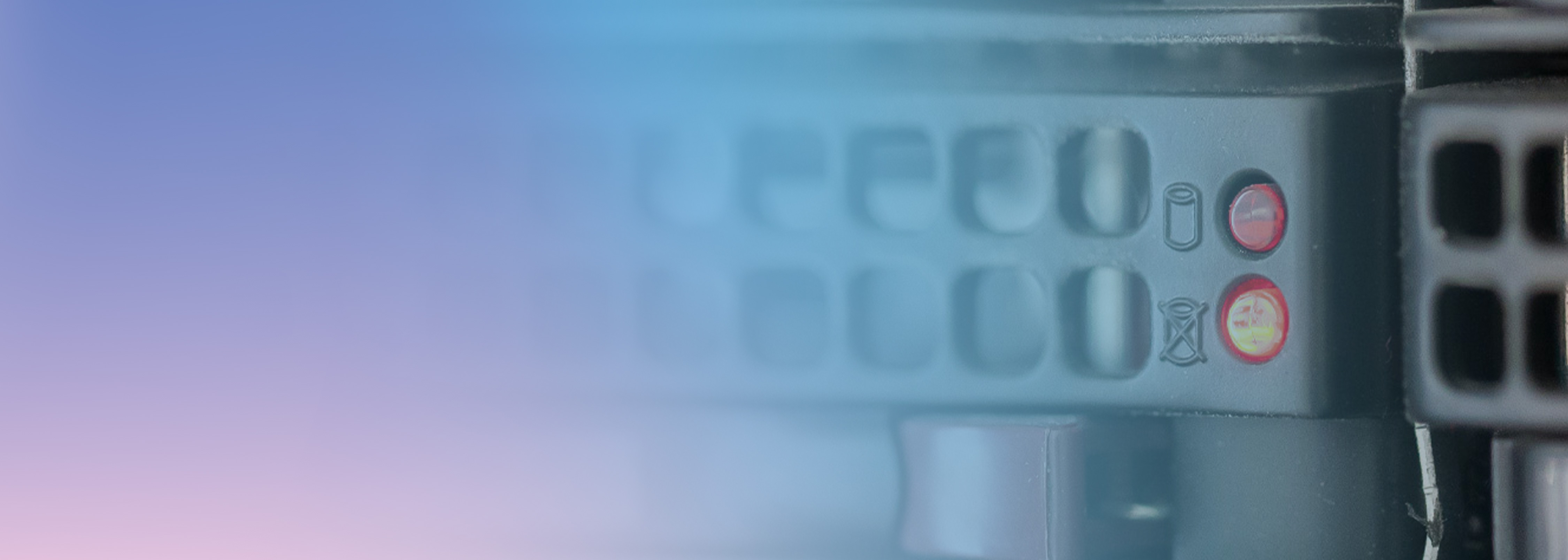 A close-up image of data center server hardware showing ventilation holes and illuminated status indicator lights, with a soft blue and purple gradient overlay.