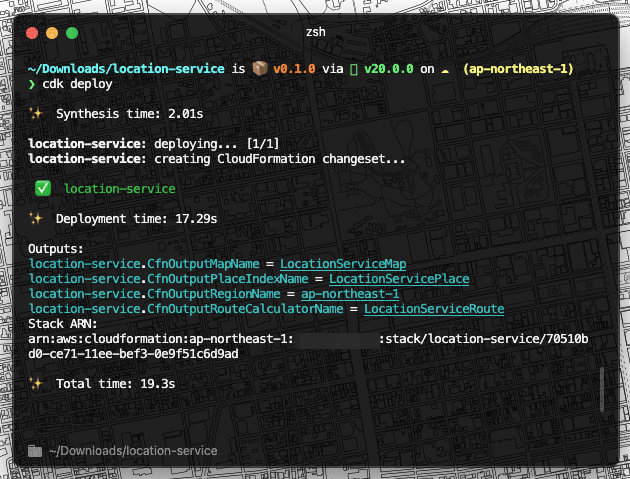 Screenshot of a terminal displaying the deployment of a Location Service stack using AWS Cloud Development Kit (AWS CDK), showing deployment steps, CloudFormation outputs, stack ARN, and regional information for ap-northeast-1.