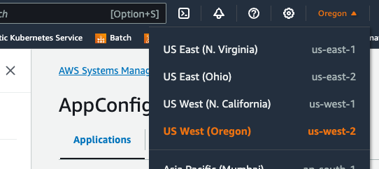 Screenshot of the AWS Management Console showing the region selection dropdown with US West (Oregon) (us-west-2) selected. The dropdown also displays other regions such as US East (N. Virginia), US East (Ohio), and US West (N. California).