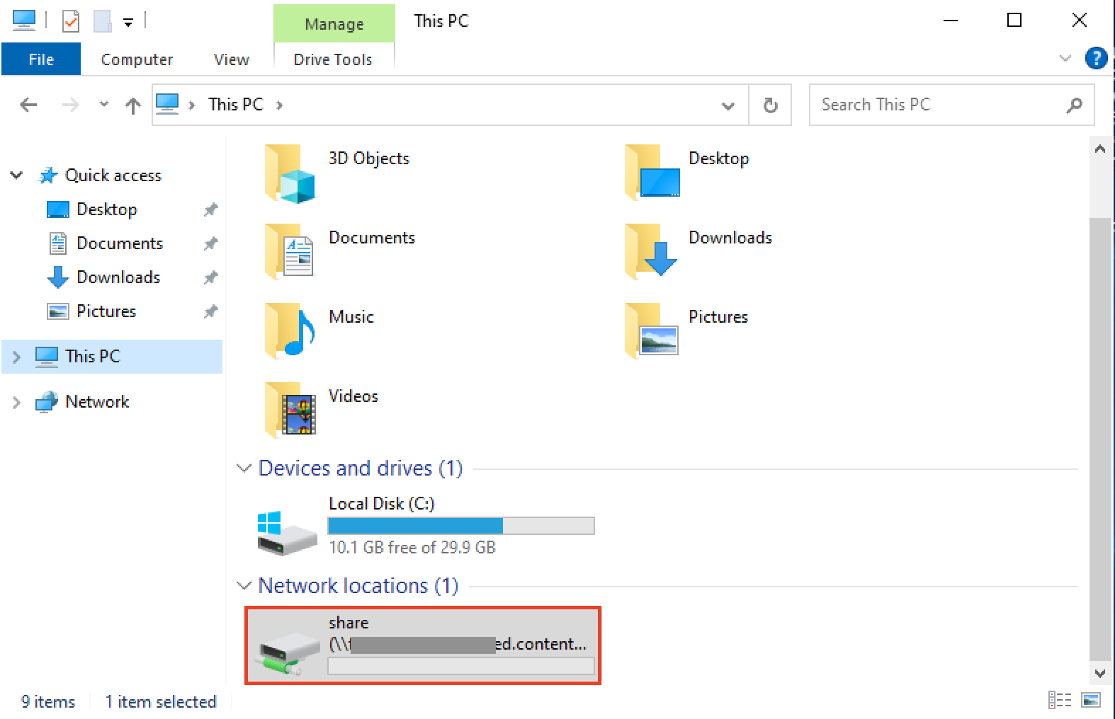 Screenshot of the Windows File Explorer displaying system folders, drives, and a mapped network location named 'share' under 'This PC' with the network path partially obscured.