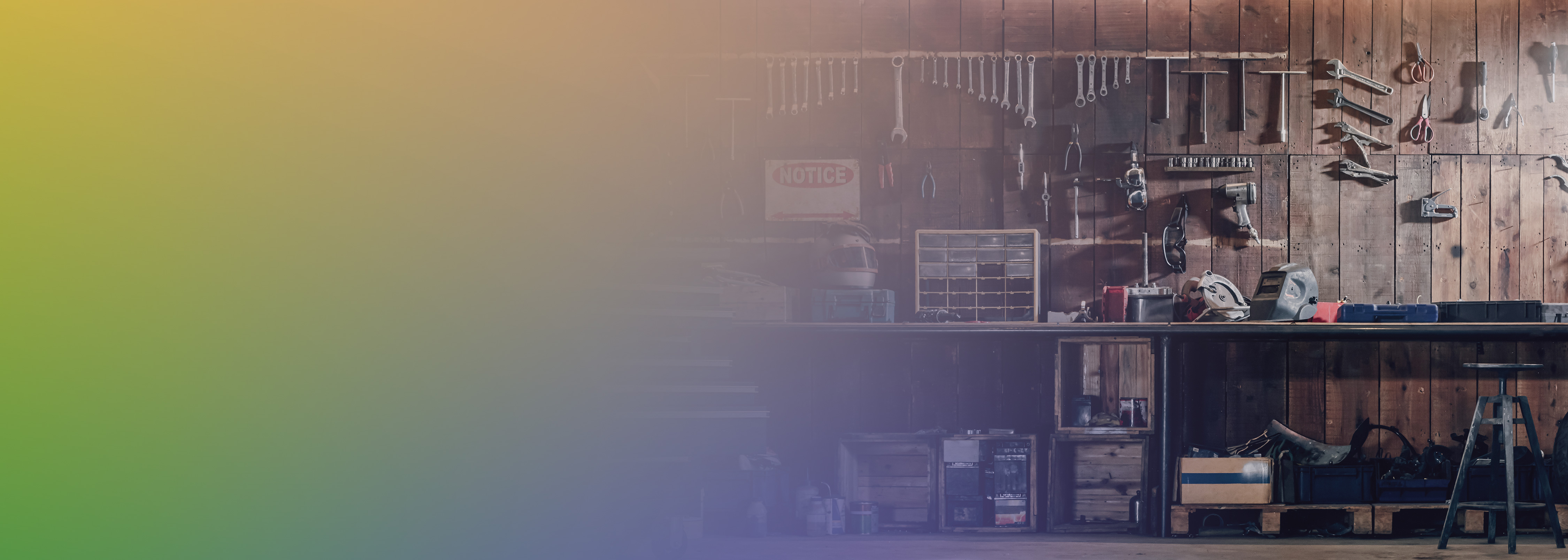 A wooden workshop featuring a bench with various tools hanging on the wall and placed on the bench, partially overlaid with a yellow-green gradient background.