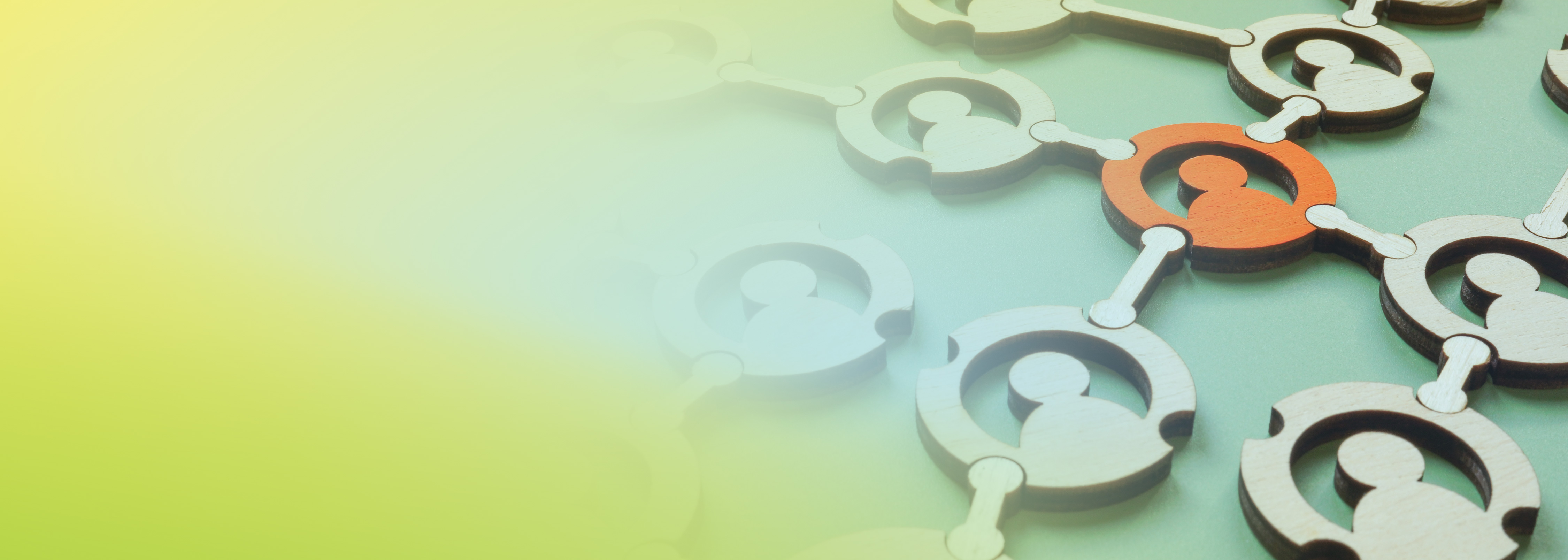 A network of interconnected wooden human icons with one icon highlighted in orange, representing connection, uniqueness, or focus within a group.