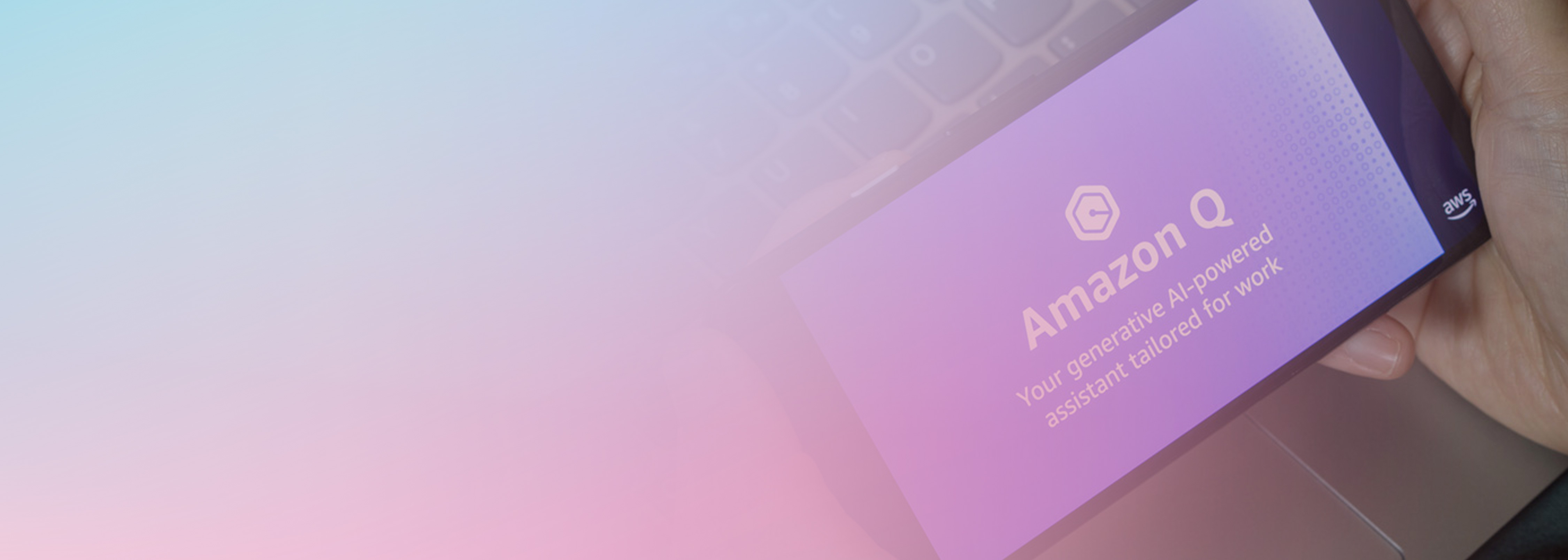 A mobile phone displaying the Amazon Q generative AI-powered assistant app, with the tagline 'Your generative AI-powered assistant tailored for work,' held in hand against a blurred pastel background.