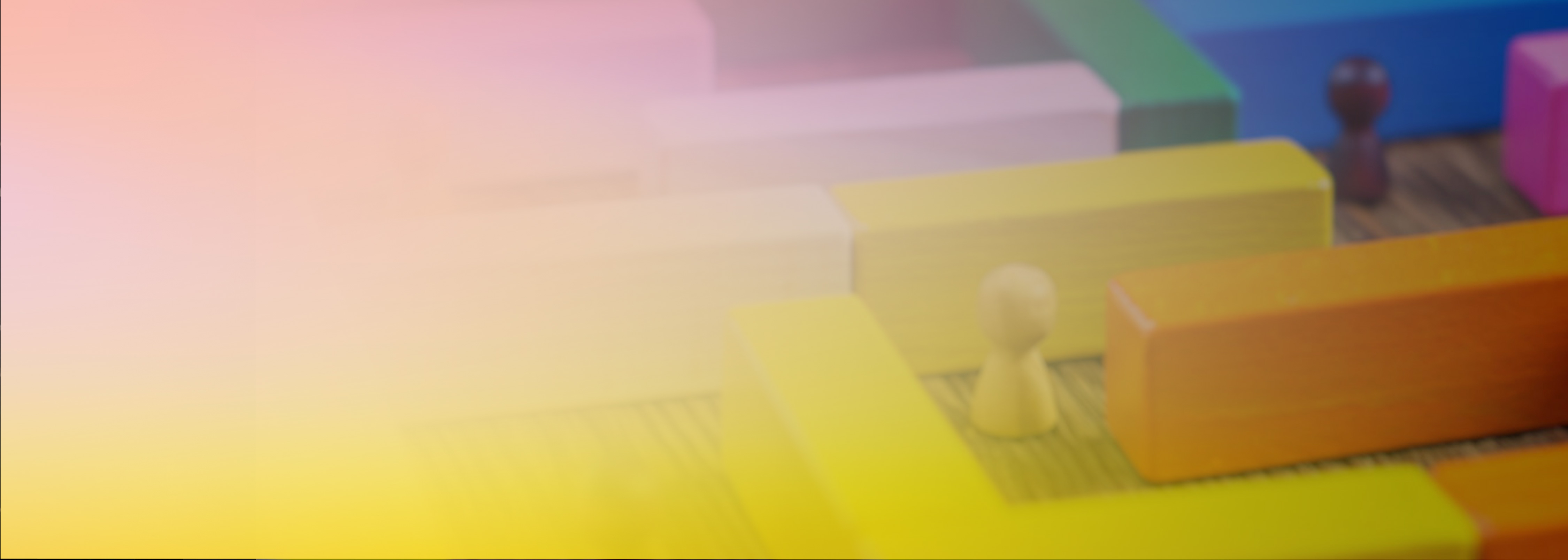 Colorful wooden blocks and game pieces arranged in a way that represents barriers, symbolizing security concepts with a soft pastel overlay.