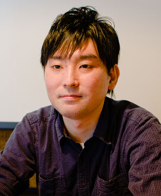 Portrait of a speaker from the Classi case study, seated and facing forward, with a neutral background.