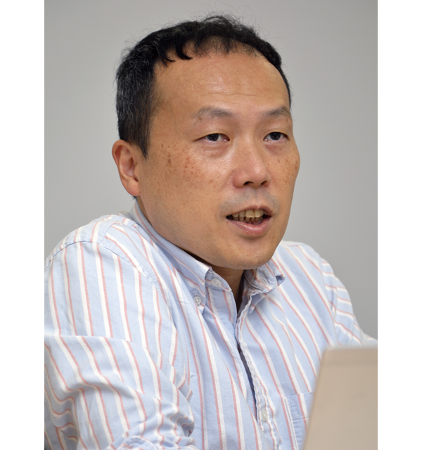 A man in a striped shirt speaking during an interview, featured in a case study for SEAOS.