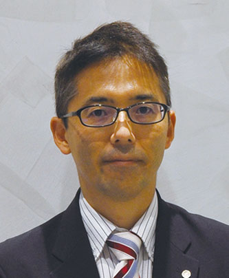 Formal portrait of a speaker in a suit and tie, associated with the JAL case study.