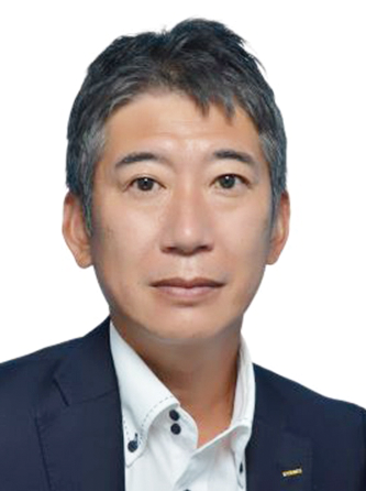 Portrait photograph of a man in a suit, used for Sysmex case study on the AWS Japan website.