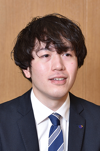 Professional portrait of a businessperson in a suit and tie, photographed against a plain background. Suitable for use in business and corporate case study materials.