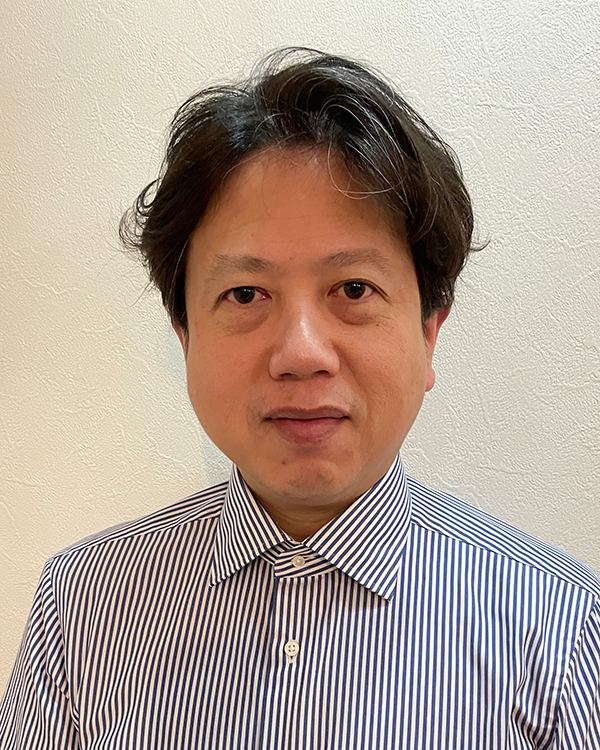 Portrait of a speaker from the Felissimo case study, wearing a striped shirt and posing against a plain background.