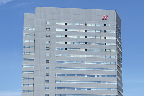 The exterior of the Nichirei Building under a blue sky, used in an AWS solution case study.