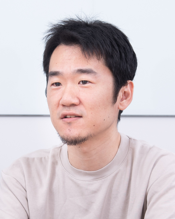 A portrait photograph of an individual in a light-colored shirt, featured as part of the Carta Holdings solution case study.