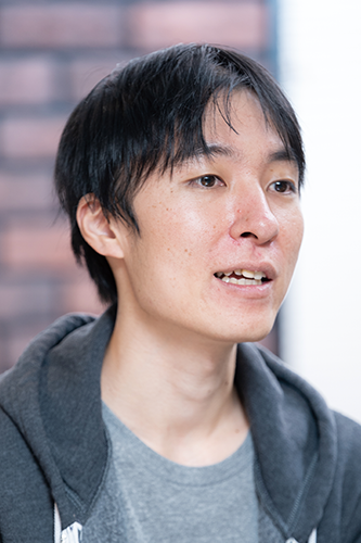 Portrait of a person in casual attire, featured in the Nulab case study for AWS Japan.