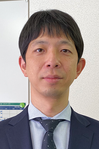 Portrait of a business professional in a suit, used for the Sapporo case study.
